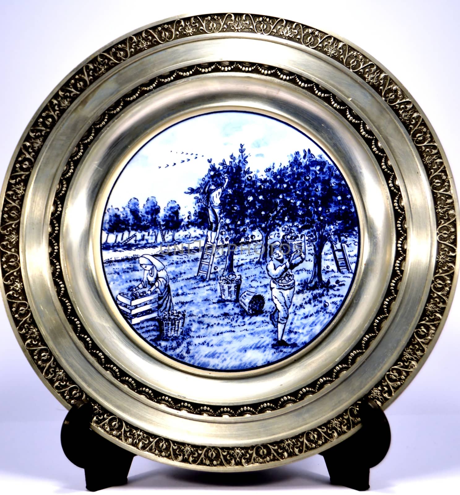 Pewter plate with a representation of the rural life.