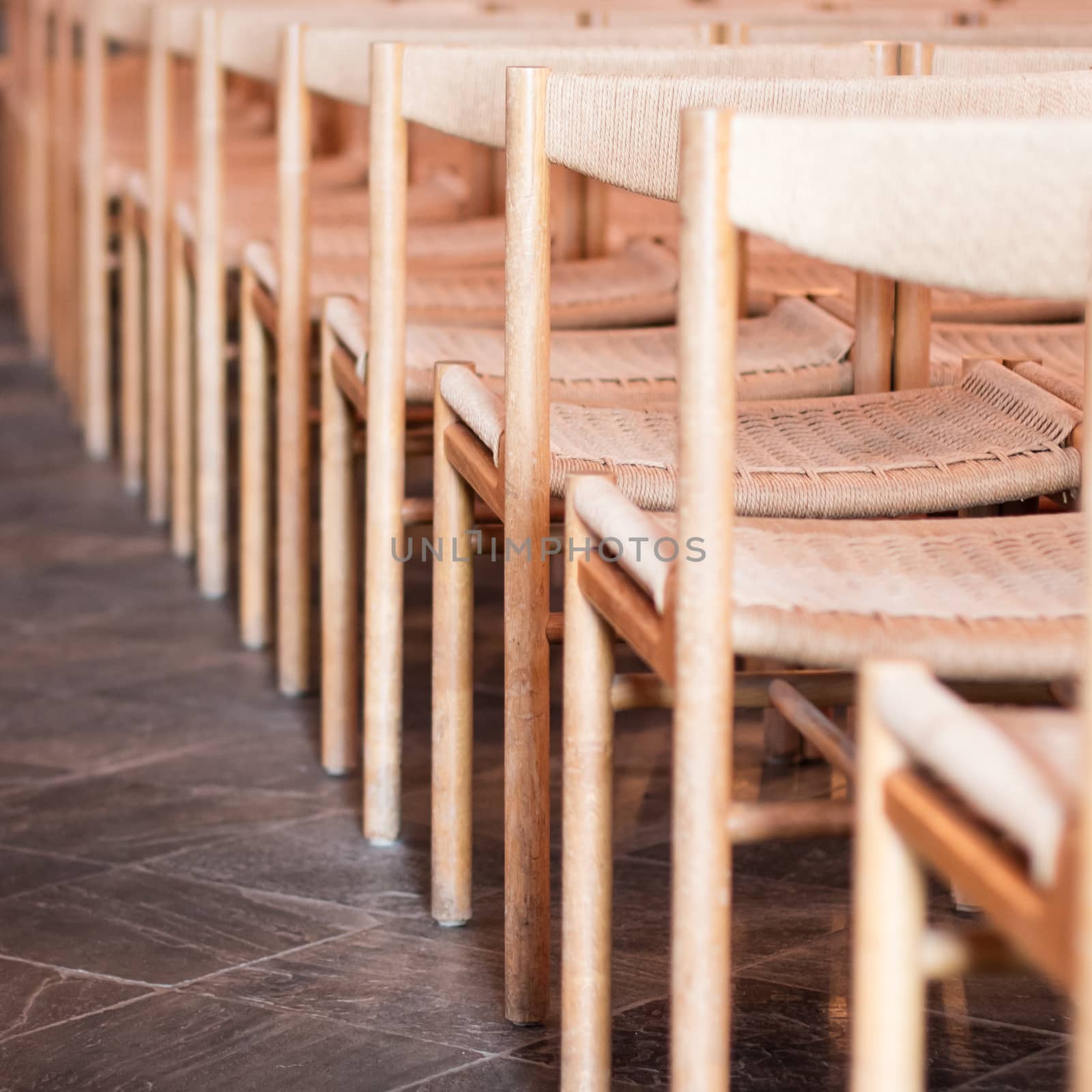 Rows of seats inside an empty church, selective focus