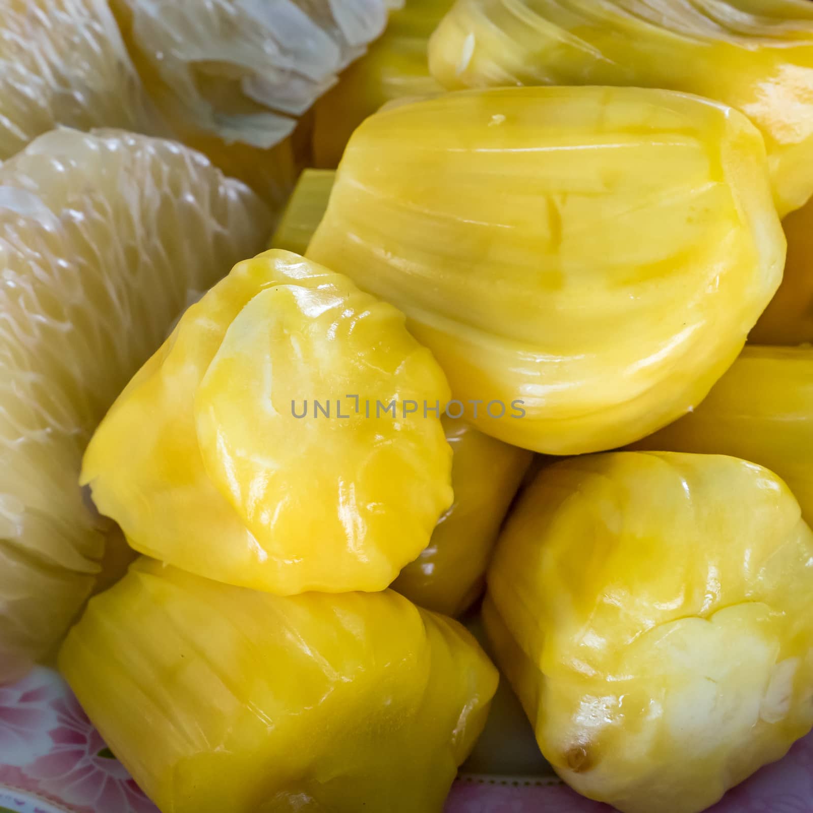 The close up of fresh tasty yellow jackfruit at the fruit market.