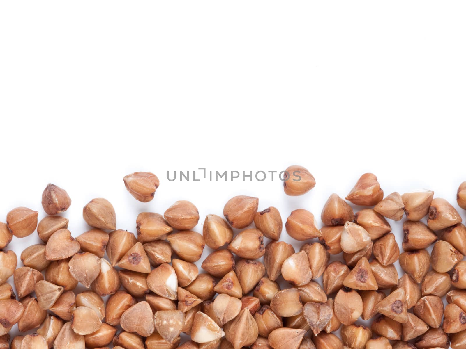 Background of buckwheat with copy space. Isolated one edge. Top view or flat lay. Healthy food and diet concept