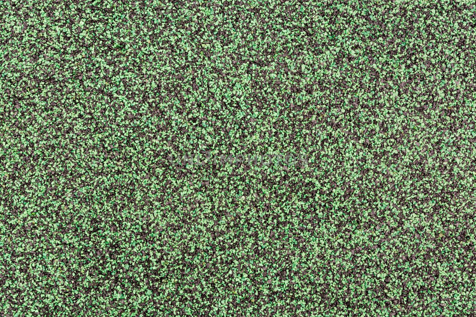 Green and Black Rubber Floor or Mat on playground.