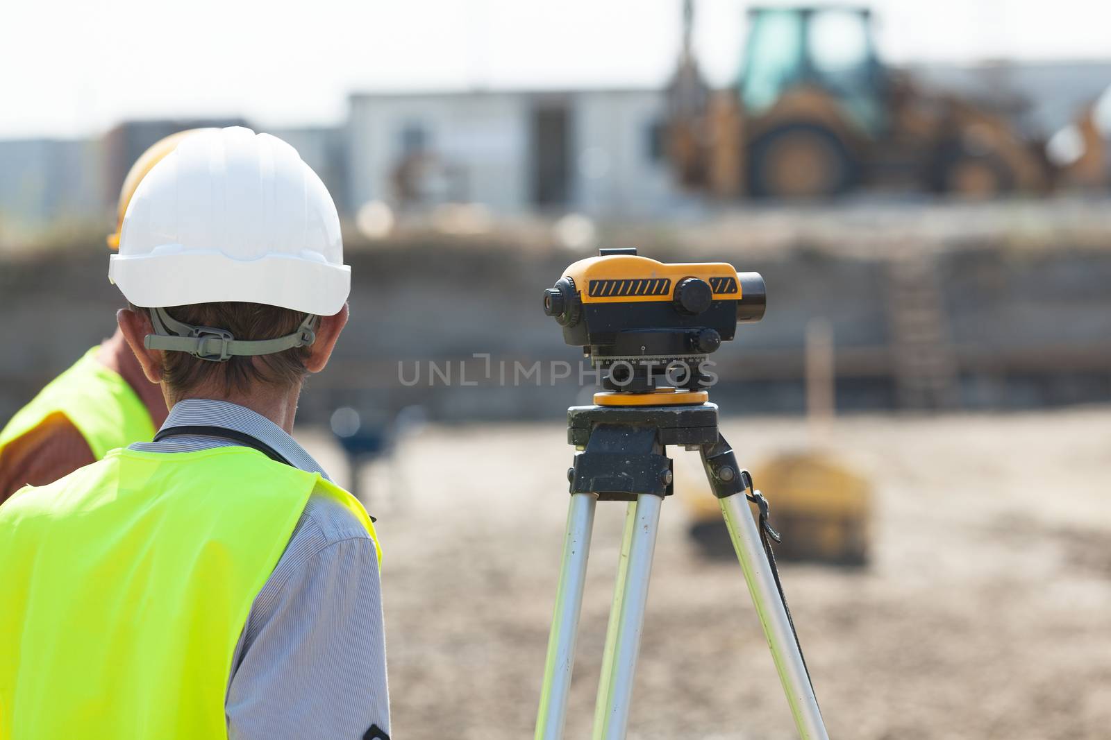 Land surveying. Construction site worker.