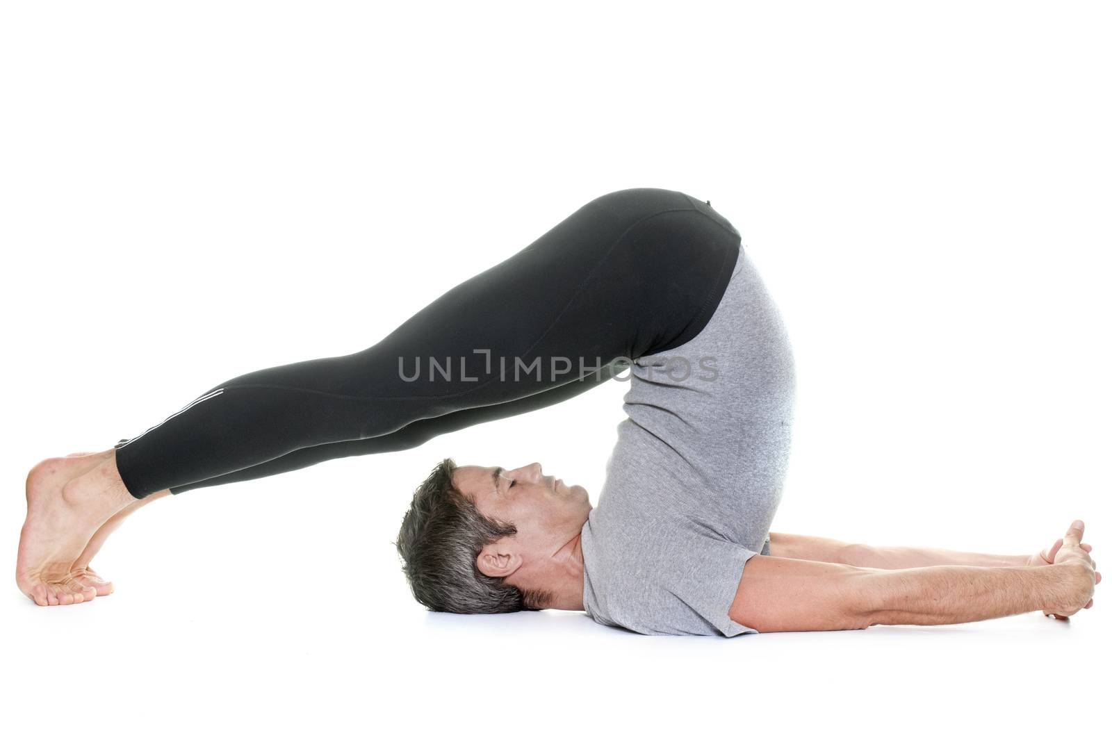 yoga man in front of white background