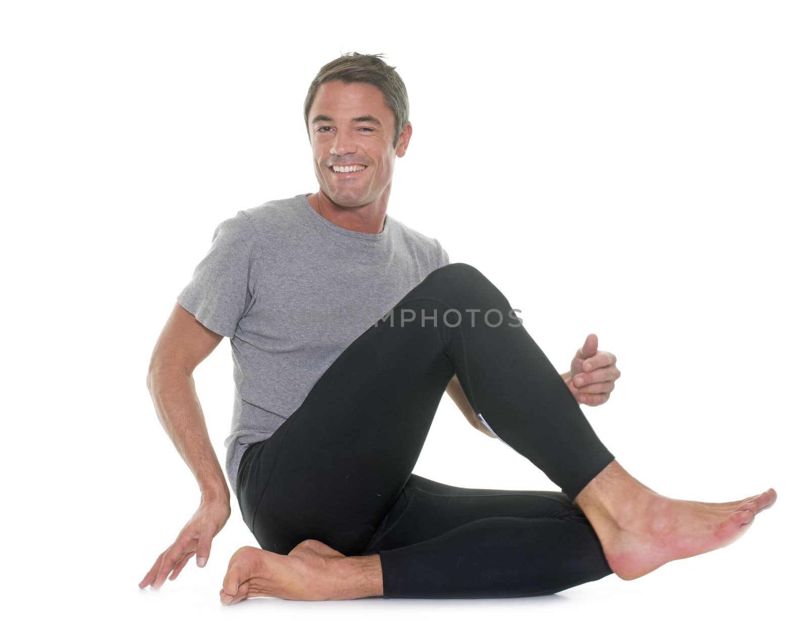 yoga man in studio by cynoclub