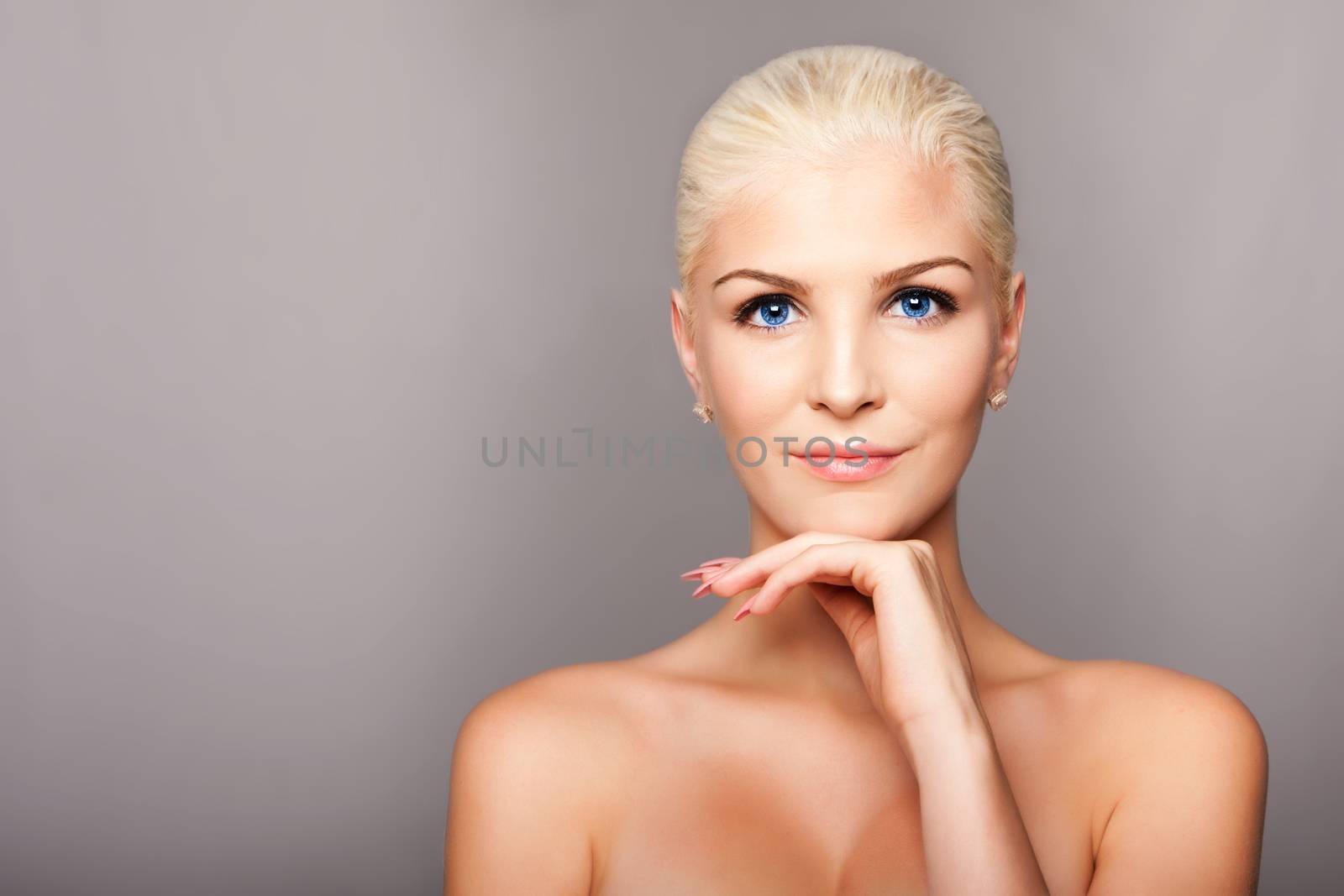 Beauty portrait face of happy smiling beautiful blond woman with blue eyes and smooth skin, aesthetics cosmetics skincare concept.