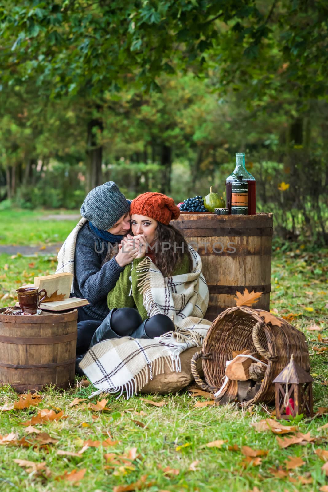 Romantic happy couple at fall in the autumn garden