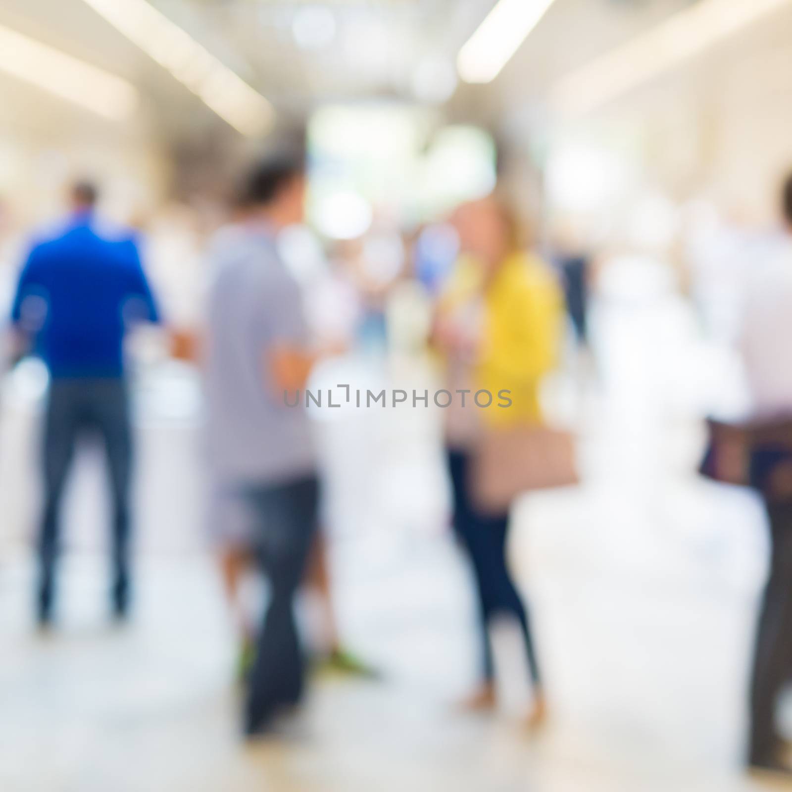 Abstract blurred people socializing during coffee break at business meeting or conference.