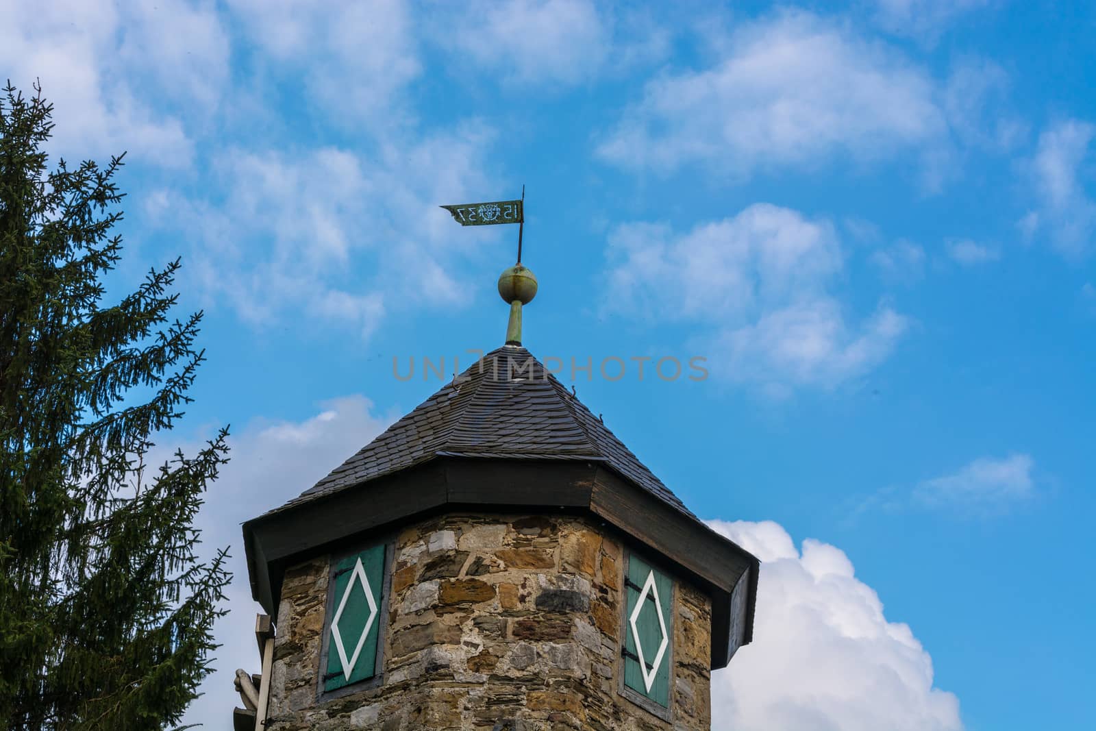 Spire of Castle Hetterscheidt in Heiligenhaus district Hetterscheidt, at Abtskuecher pond.
