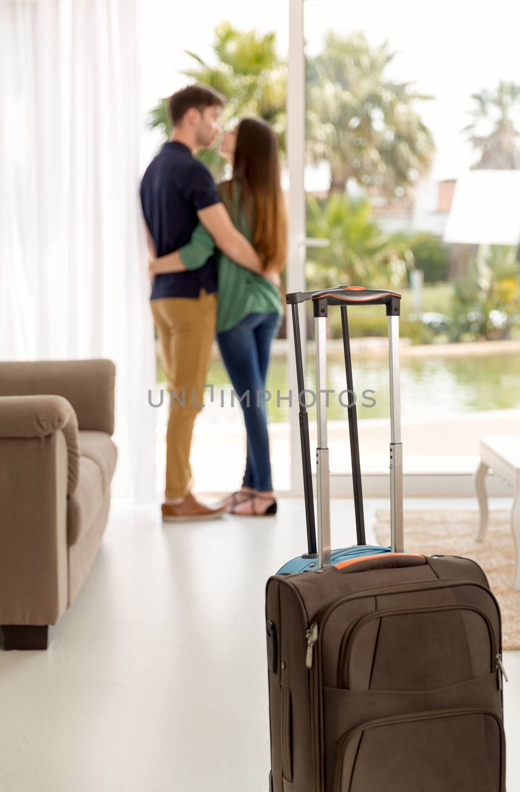 Young couple arriving the hotel for holidays