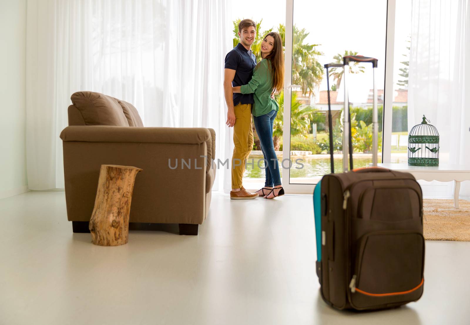 Young couple arriving the hotel for holidays