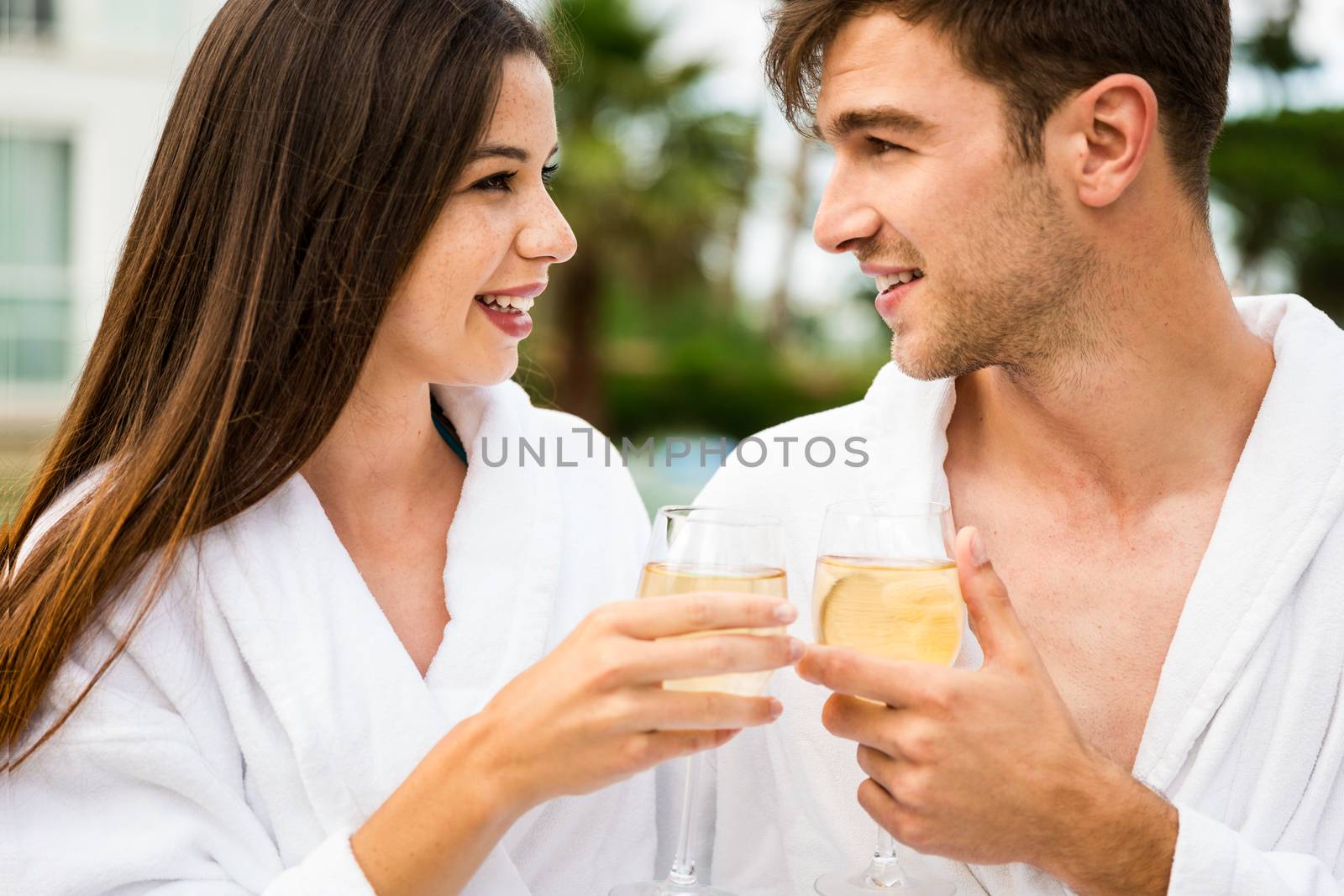 Young couple tasting wine by Iko