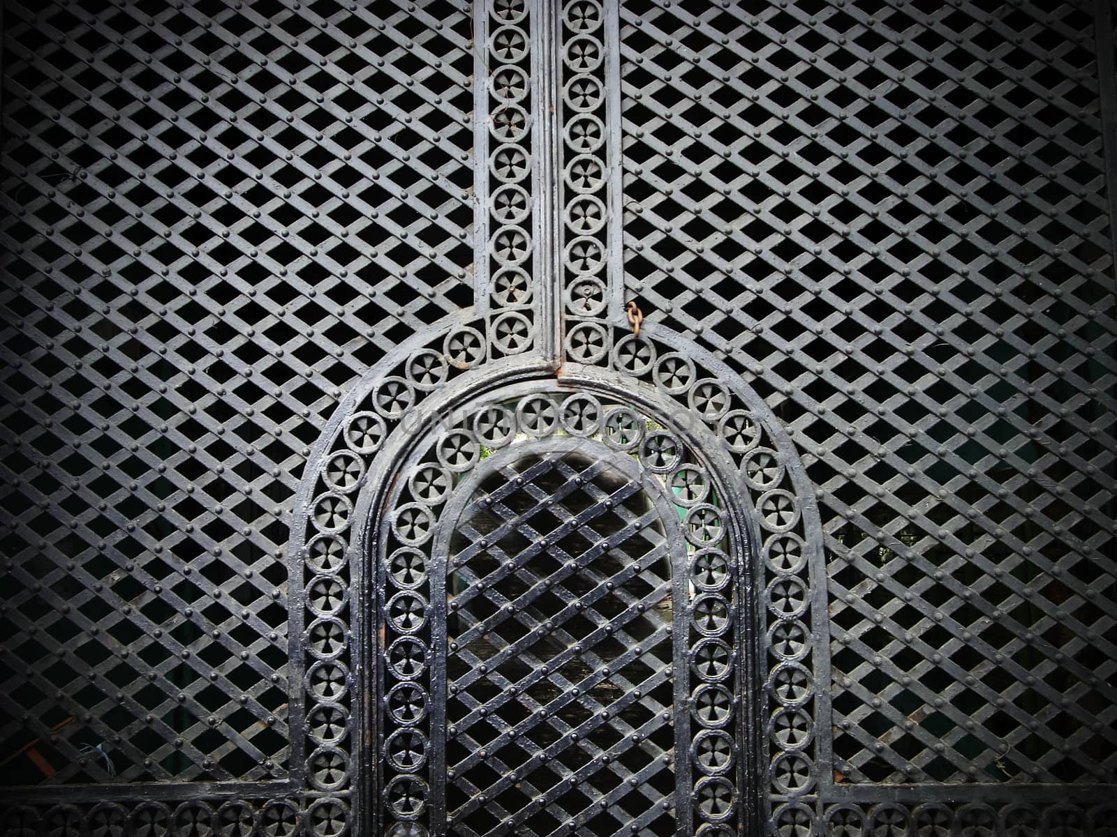 Iron door in the Muslim style. In oriental style. In one of the courtyards of the old town.
