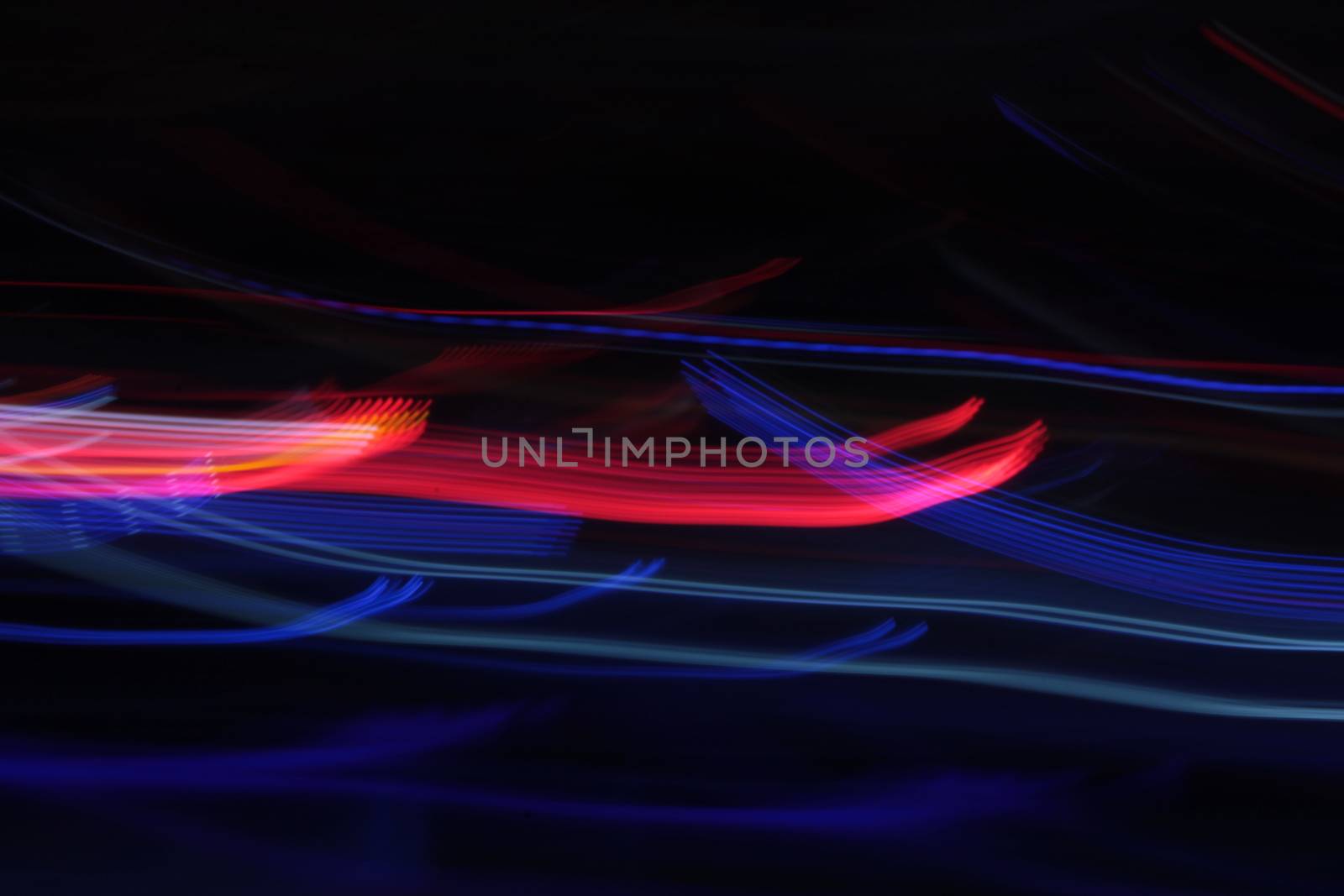 Night colors of the amusement park lights moving, light trails, slow shutter-speed