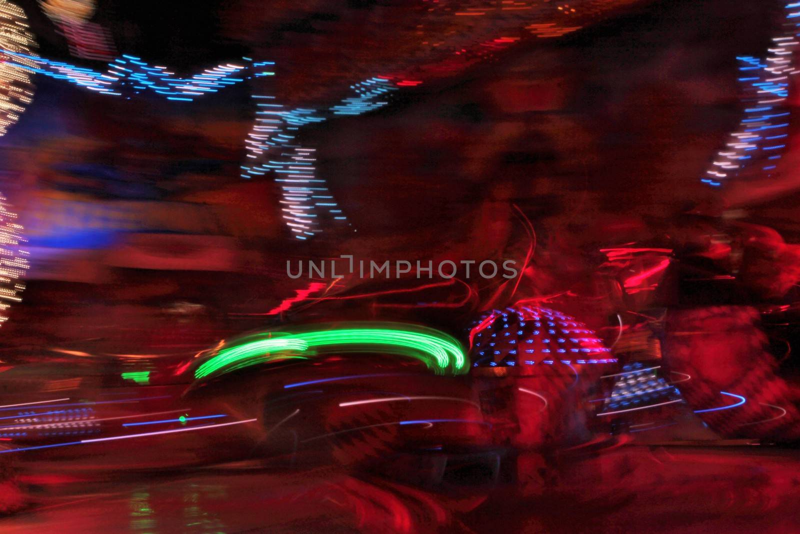 Night colors of the amusement park lights moving, light trails, slow shutter-speed