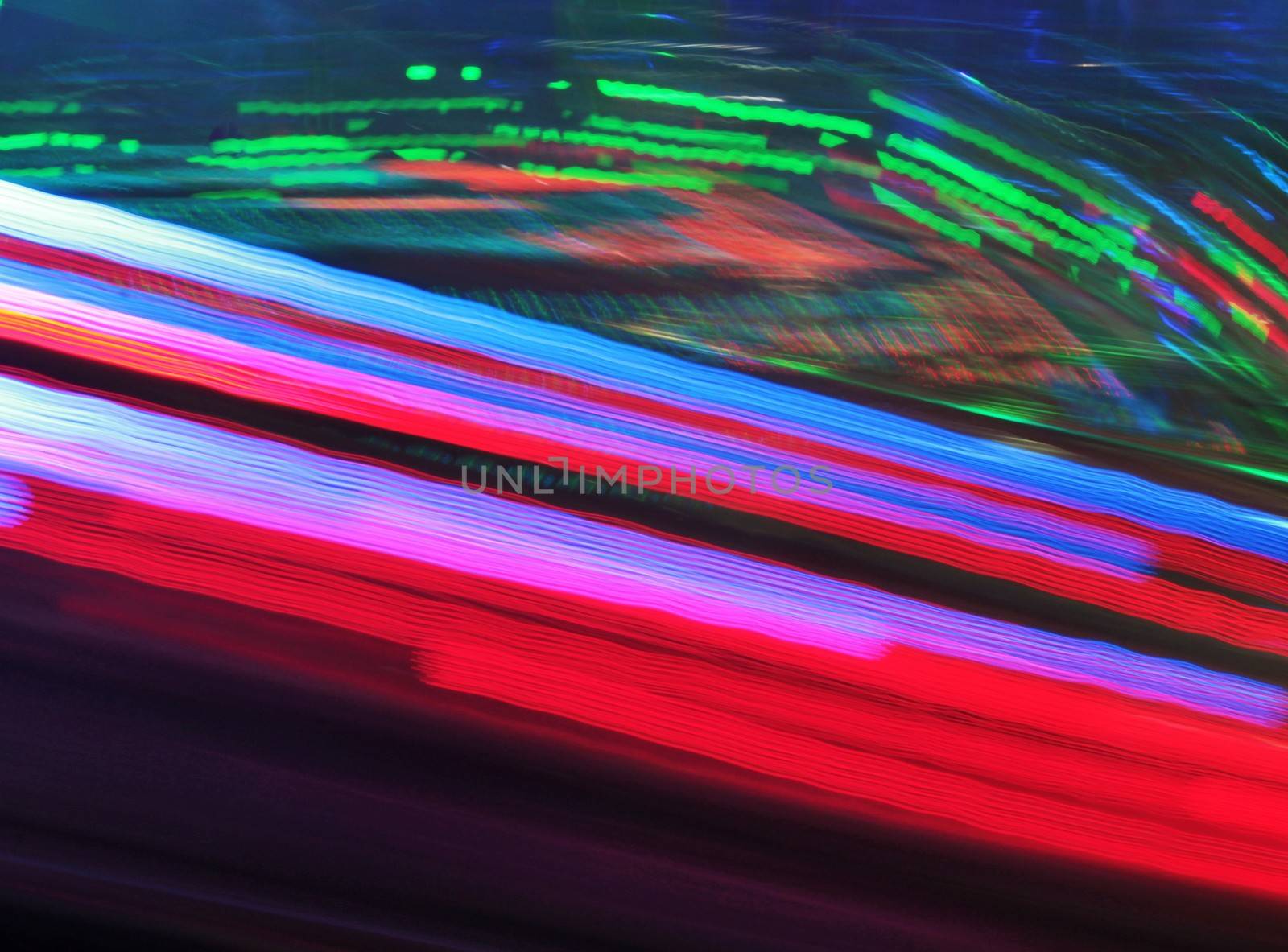 Night colors of the amusement park lights moving, light trails, slow shutter-speed