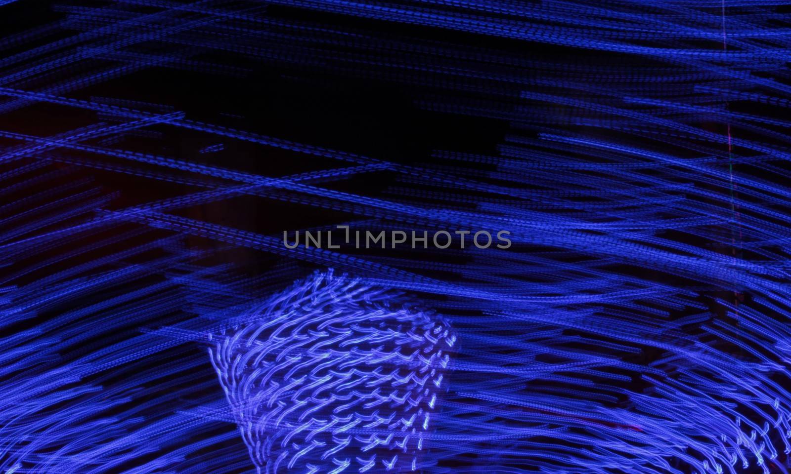 Night colors of the amusement park lights moving, light trails, slow shutter-speed