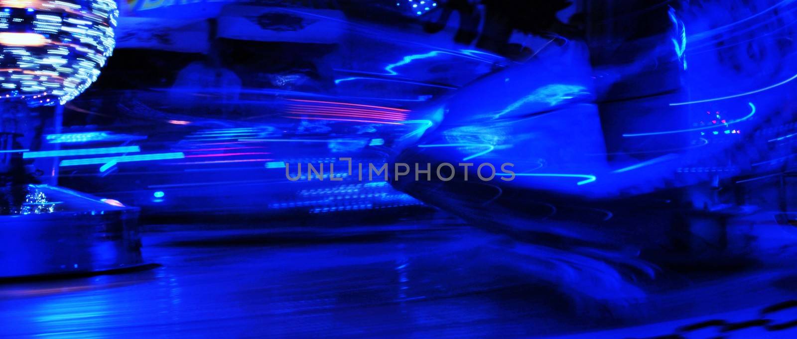 Night colors of the amusement park lights moving, light trails, slow shutter-speed