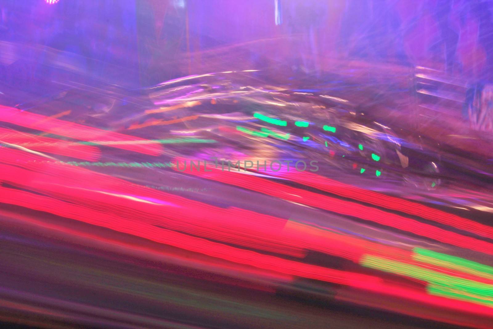 Night colors of the amusement park lights moving, light trails, slow shutter-speed