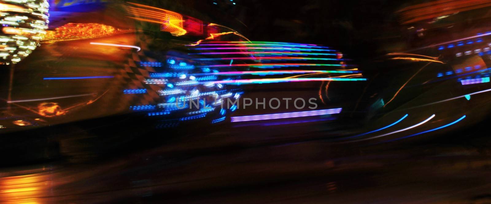 Night colors of the amusement park lights moving, light trails, slow shutter-speed