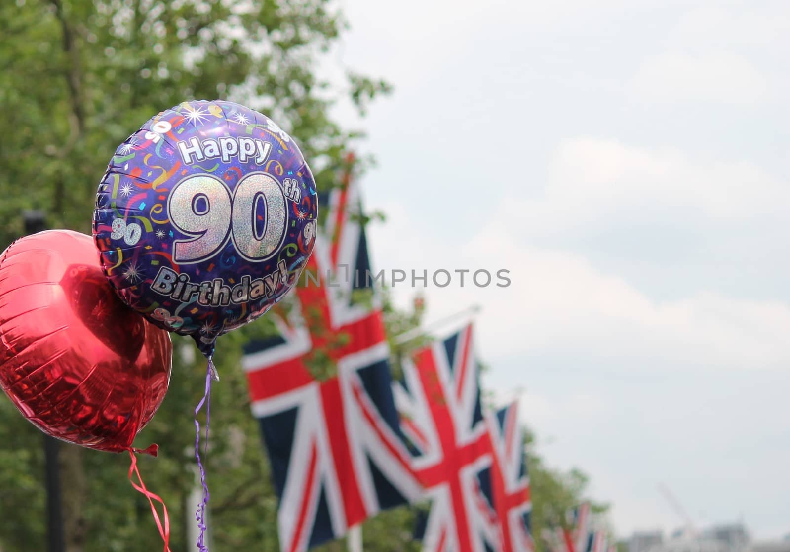 Queens 90th Birhday 2016 balloon s and Union Jack flags copy space by cheekylorns