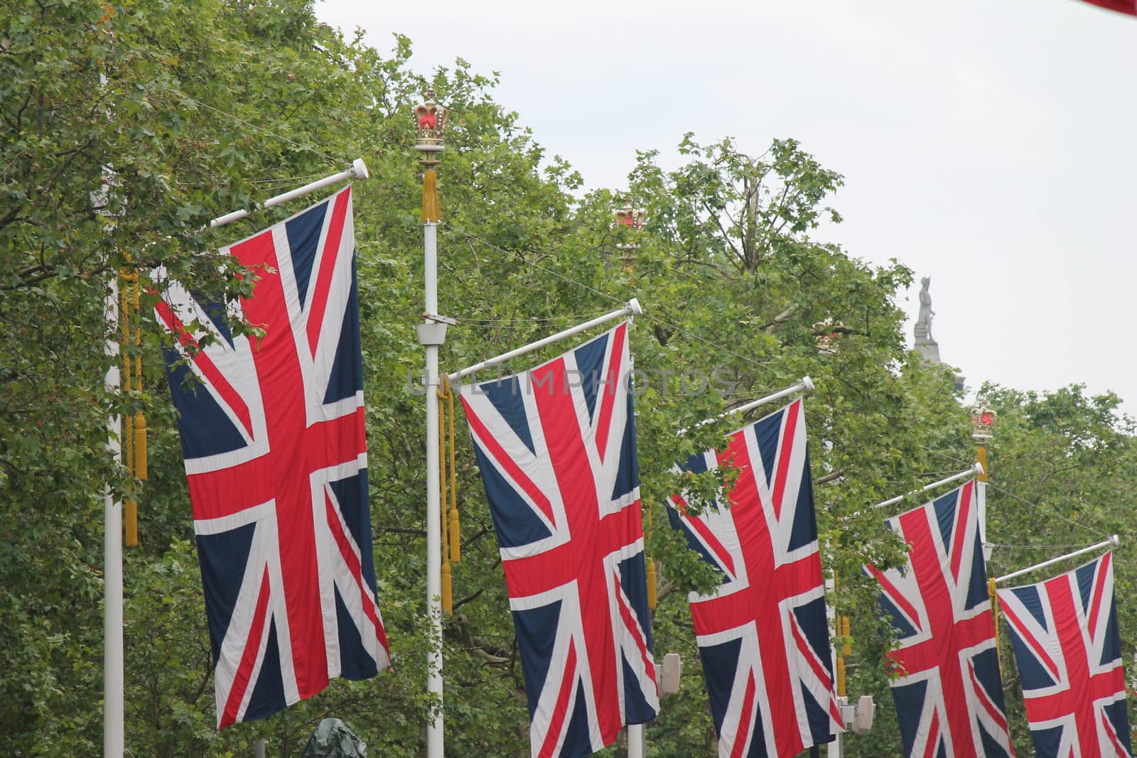 Many defocussed Union Jack flags background copy space by cheekylorns