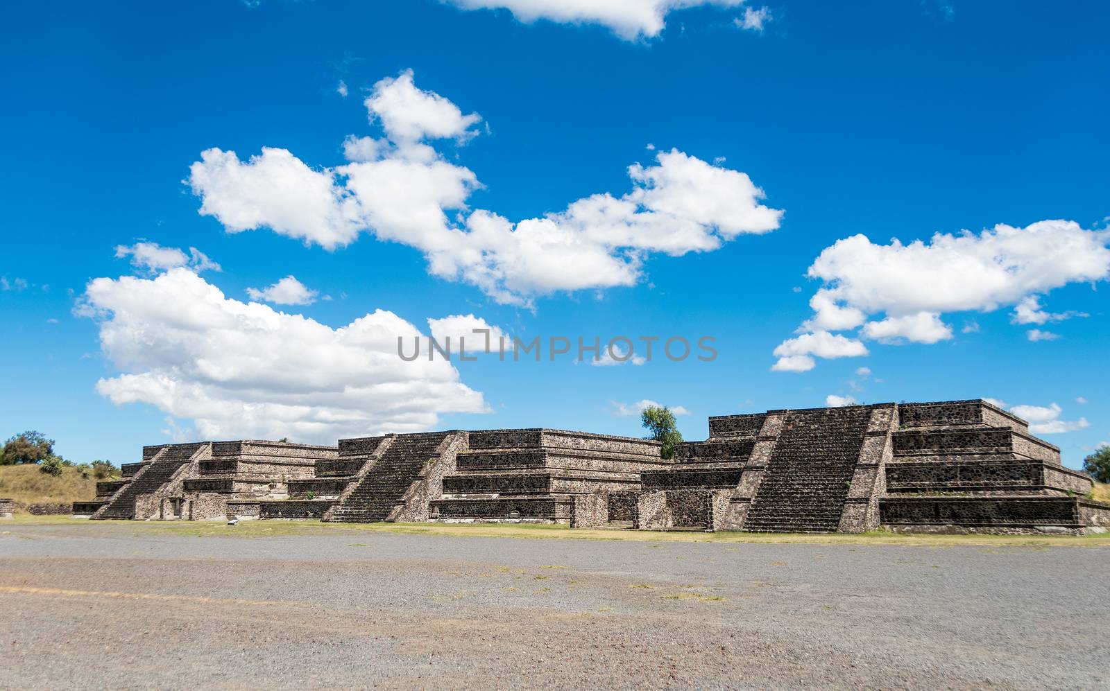 Three of the twelve small pyramids surrounding the Plaza of the Moon in front of the Pyramid of the Moon in San Juan Teotihuacan, Mexico. The structures are fron the period before 200 AD.