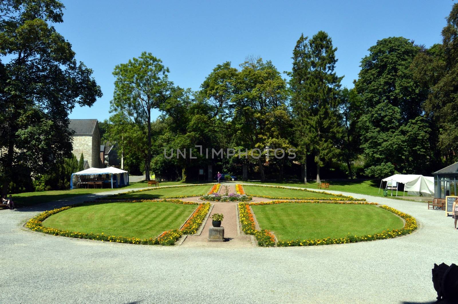 Flowerbed of flowers natures in the shape of circle with a path.