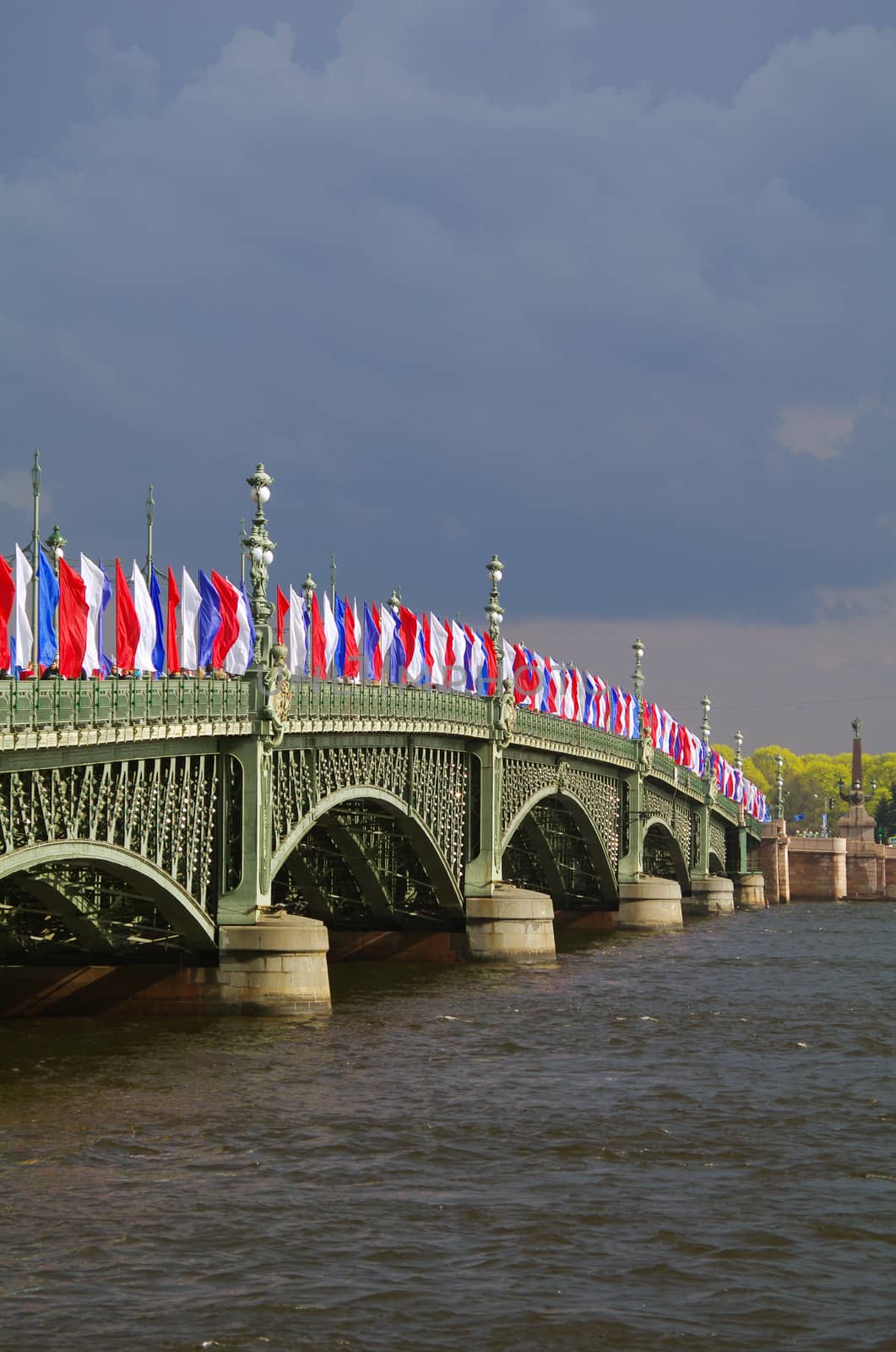 SAINT PETERSBURG, RUSSIA - MAY10, 2014: Bascule Trinity Troitsky Bridge across the Neva river with tricolor flags by evolutionnow