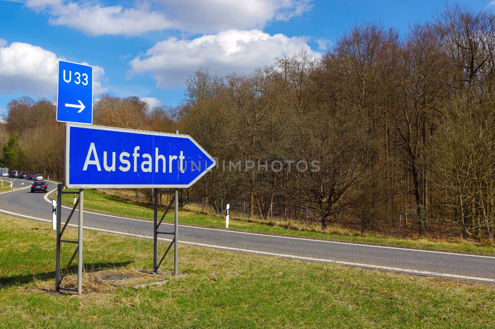 German road sign: signpost at junction, translation: exit by evolutionnow