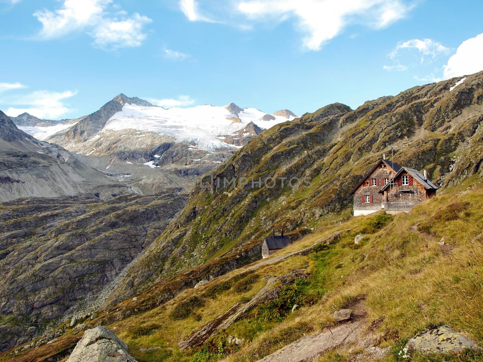 alpine house on the glacier mountains, switzerland alps