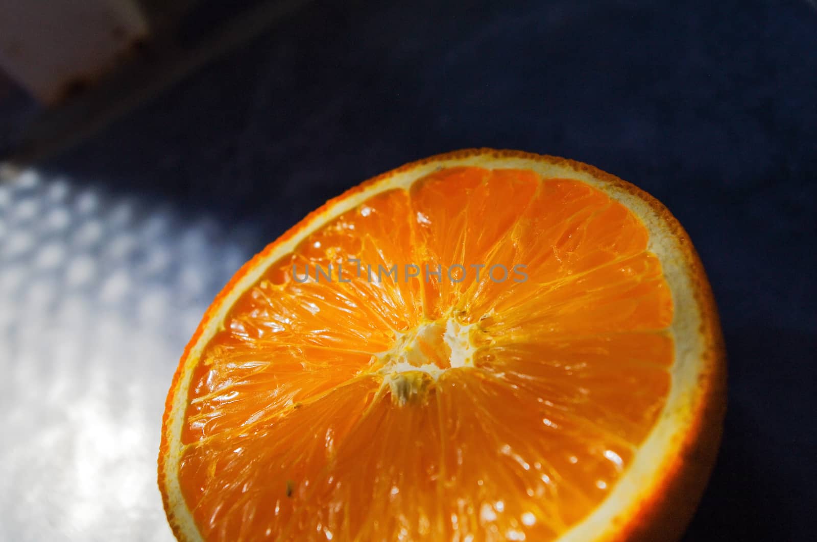 a fresh orange halve's side by side closeup, oranges cut in half