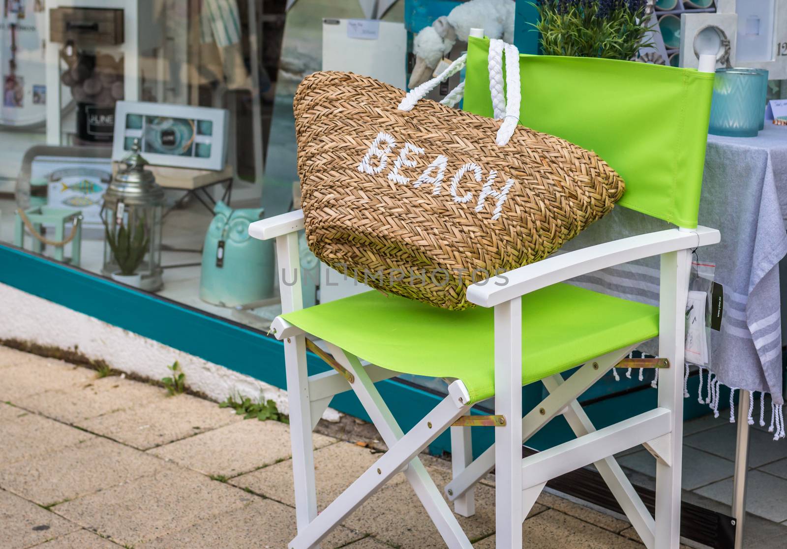 Beach bag on a green Chair on the street