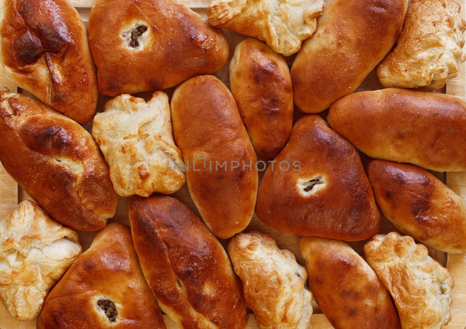Background from the baked crisp pies of various form