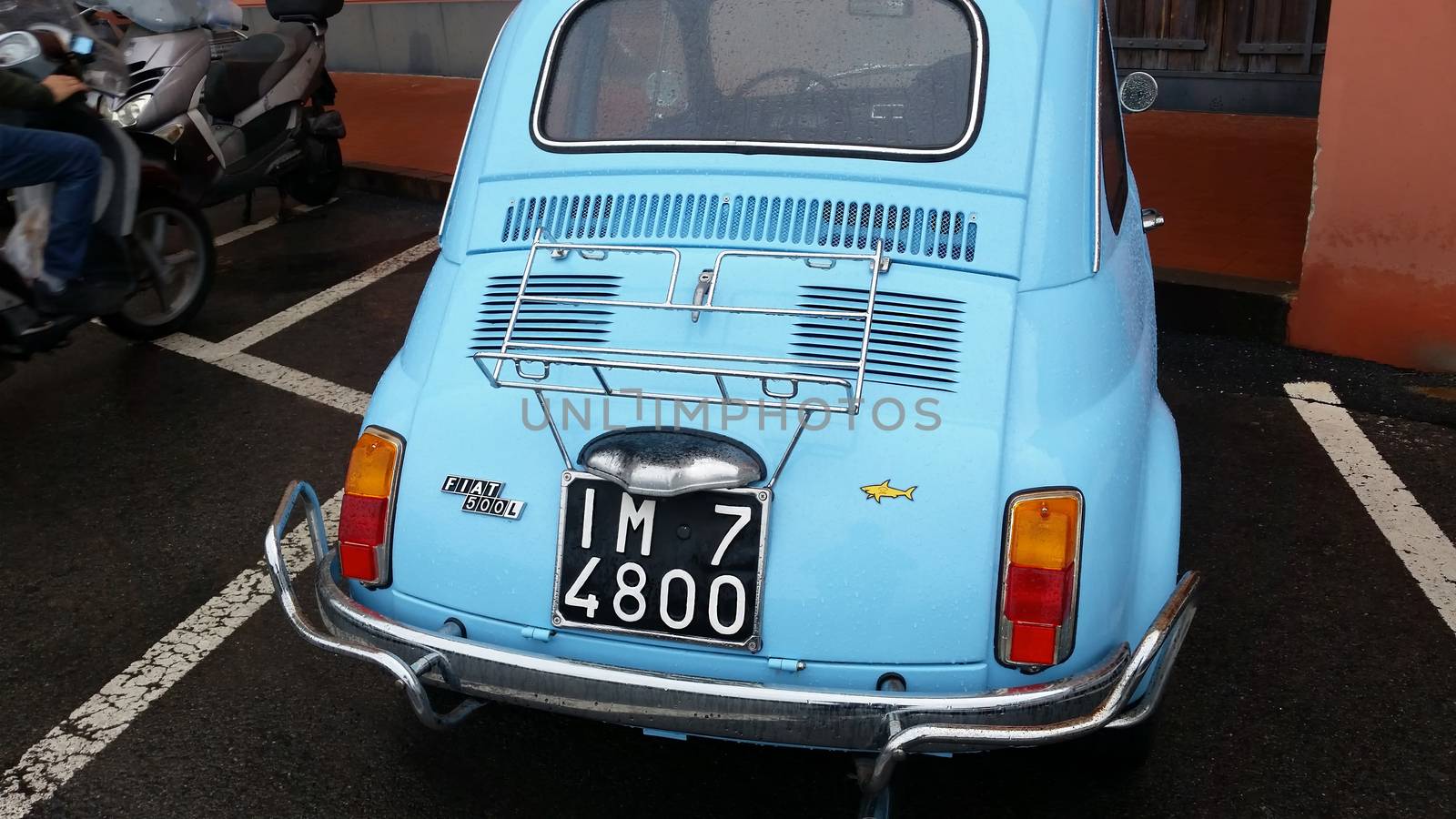 Ventimiglia, Italy - October 23, 2016: Small Italian Car Fiat 500 Parked on the Street of Ventimiglia. Blue Fiat 500 L