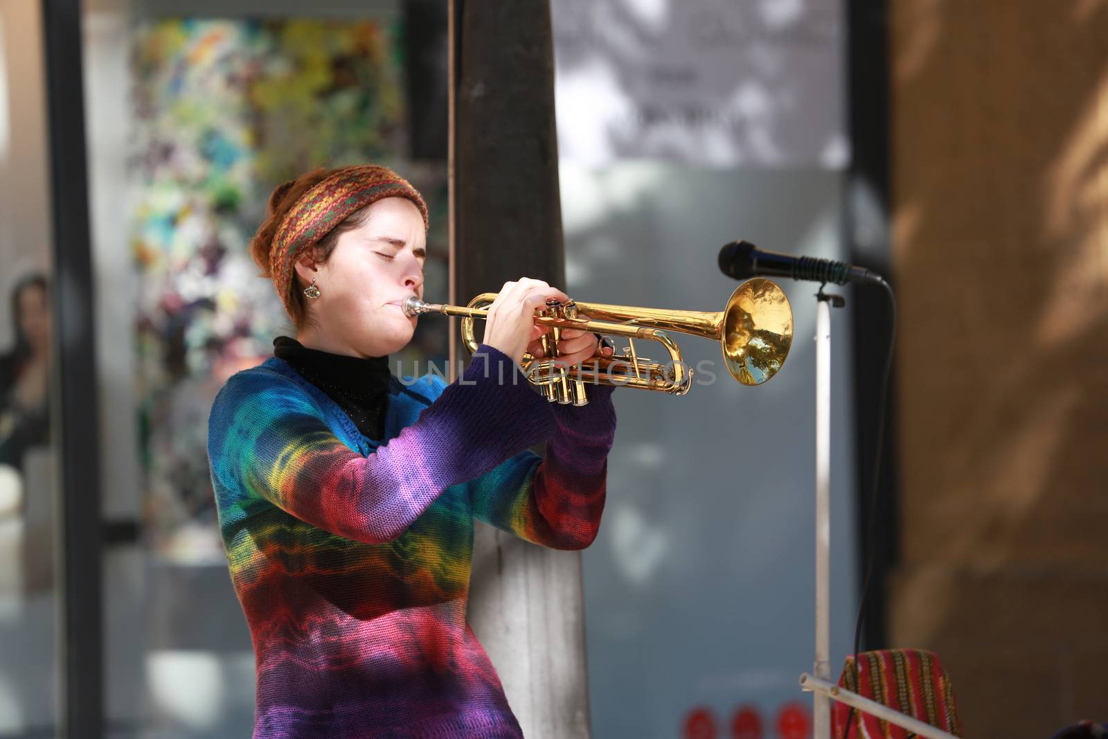 Aix-En-Provence, France - October 21, 2016: Young Woman Playing the Trumpet in the Street (Cours Mirabeau) in Aix-En-Provence, France