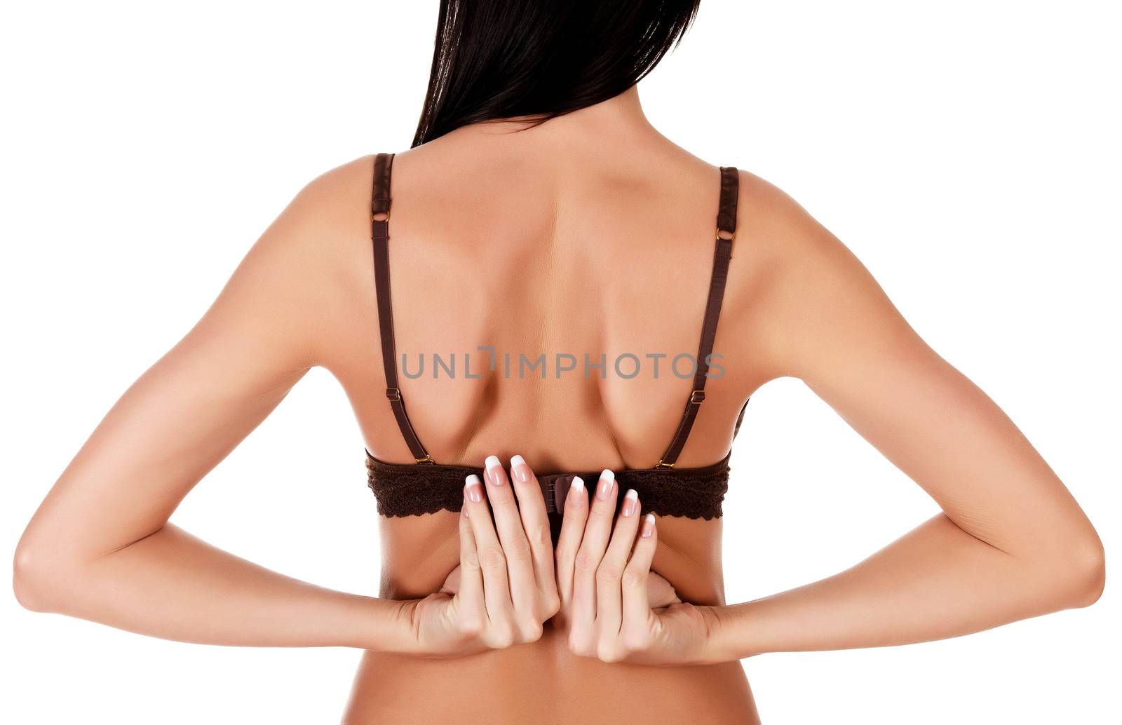 Woman takes off a bra, isolated on white background
