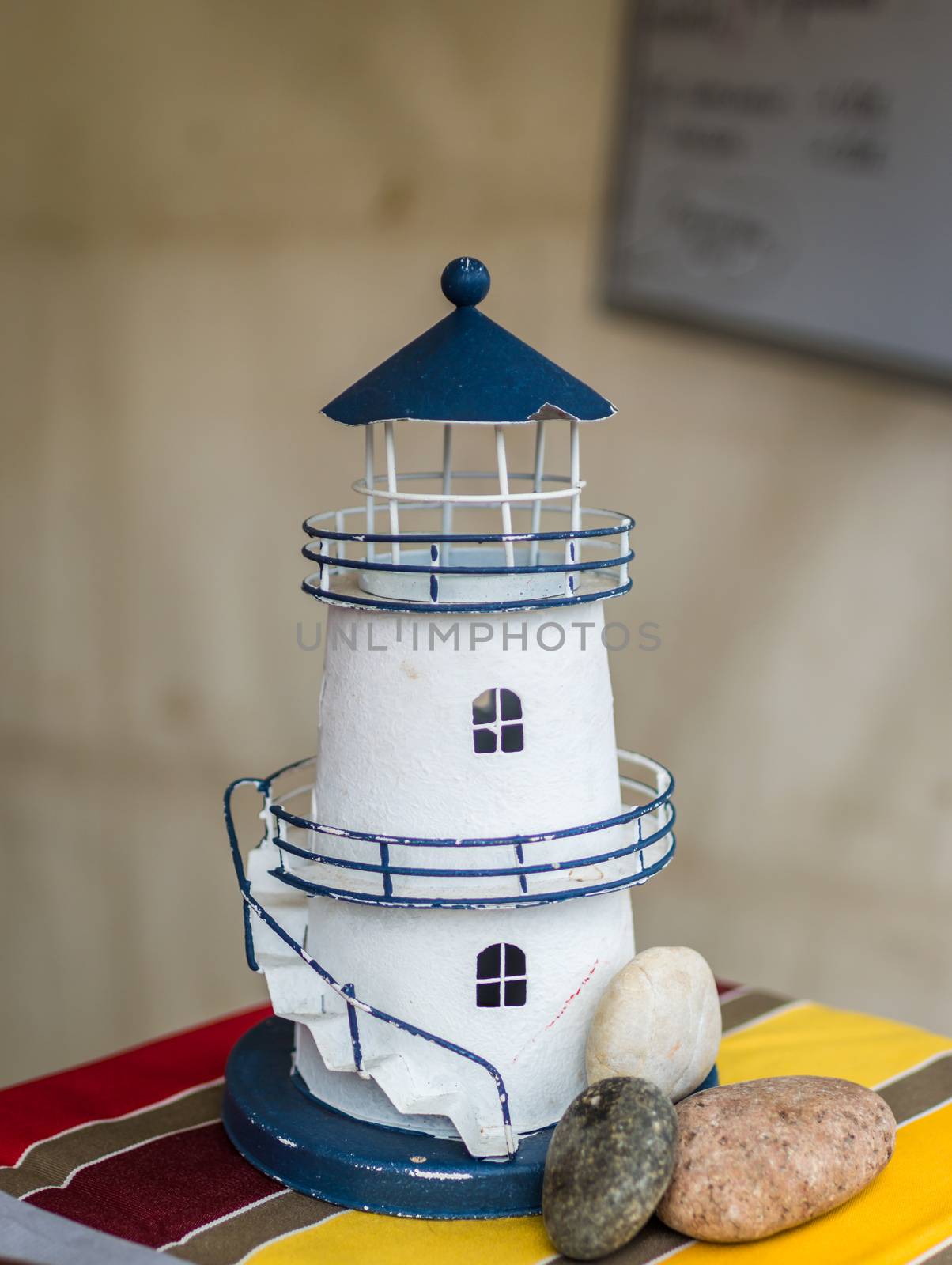 White decorative lighthouse on the counter in France
