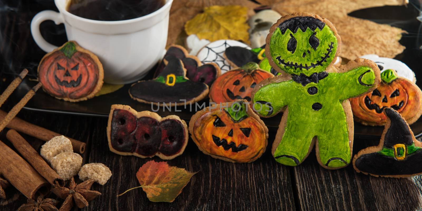 Homemade delicious ginger biscuits for Halloween on wooden table