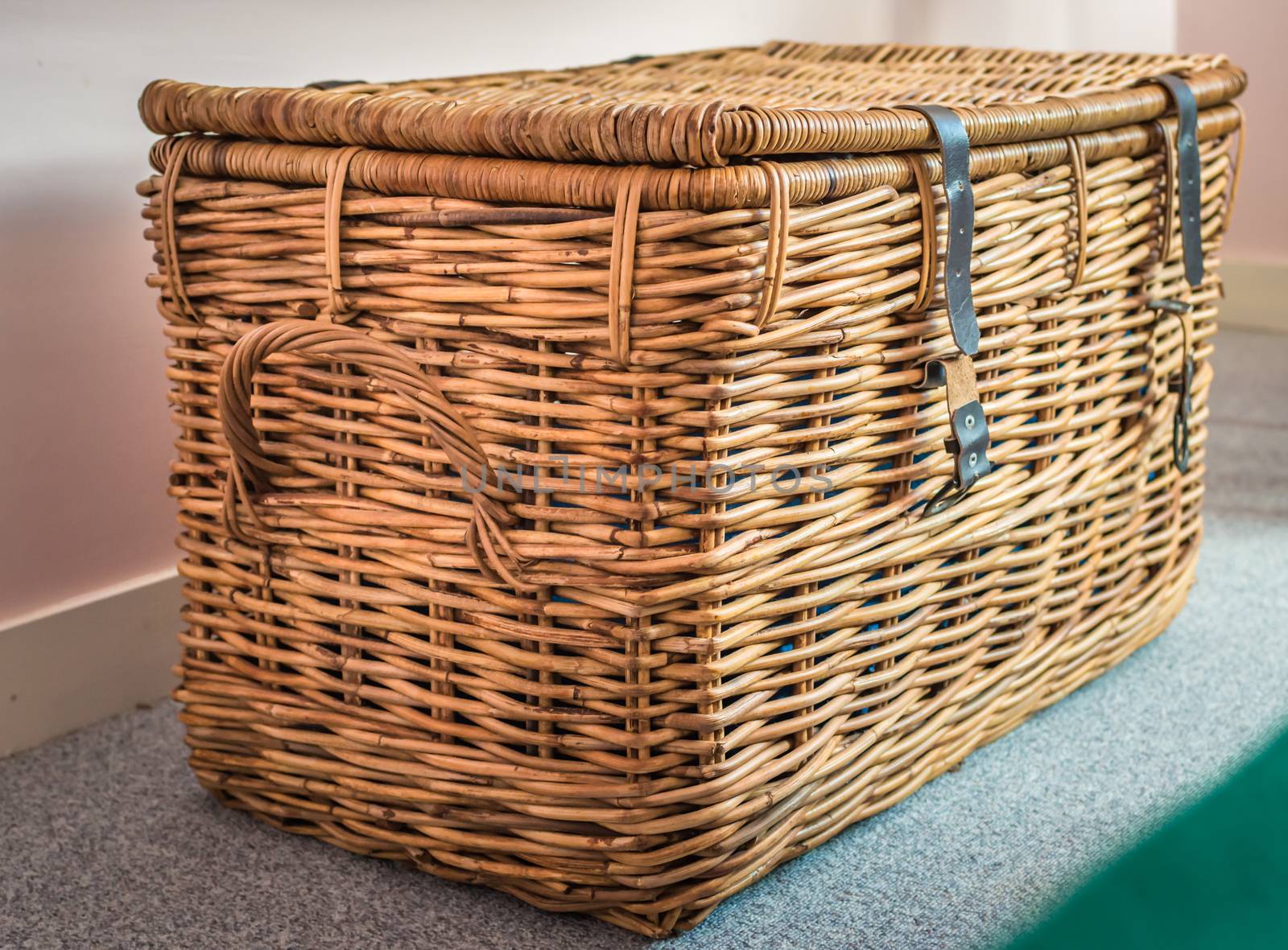 Wicker basket on the background in the room