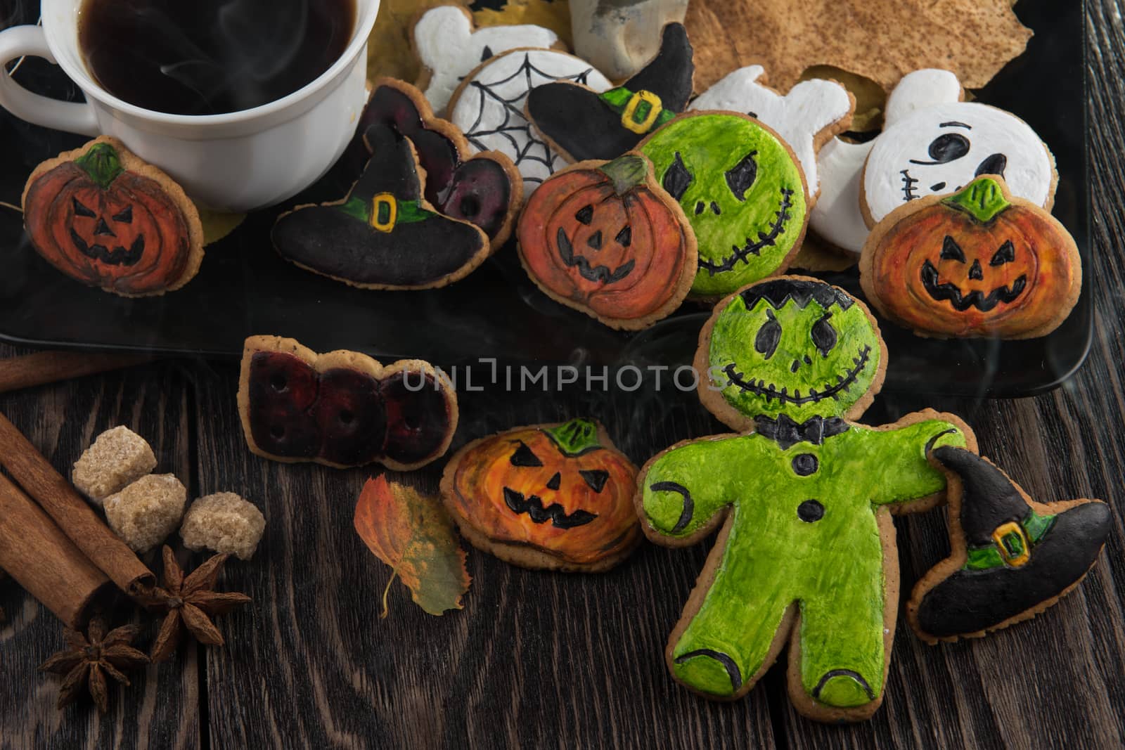 Homemade delicious ginger biscuits for Halloween on wooden table