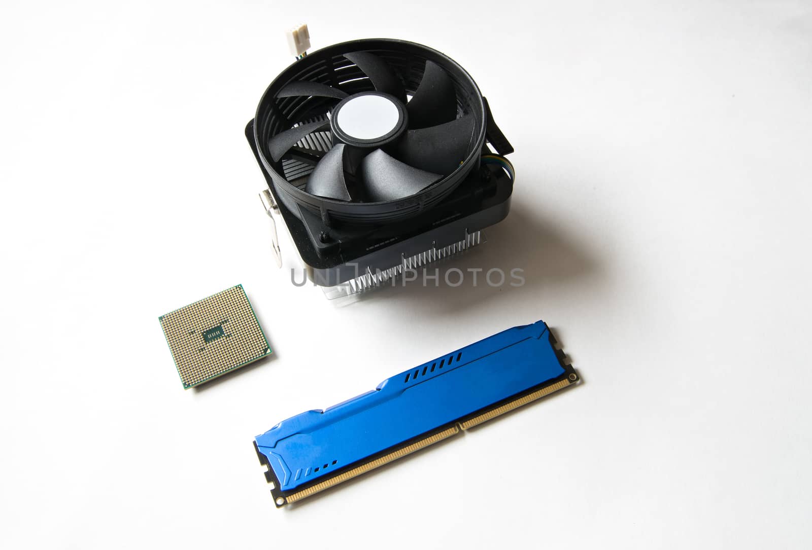 Computer components on a white background. CPU, DDR RAM, Cooler