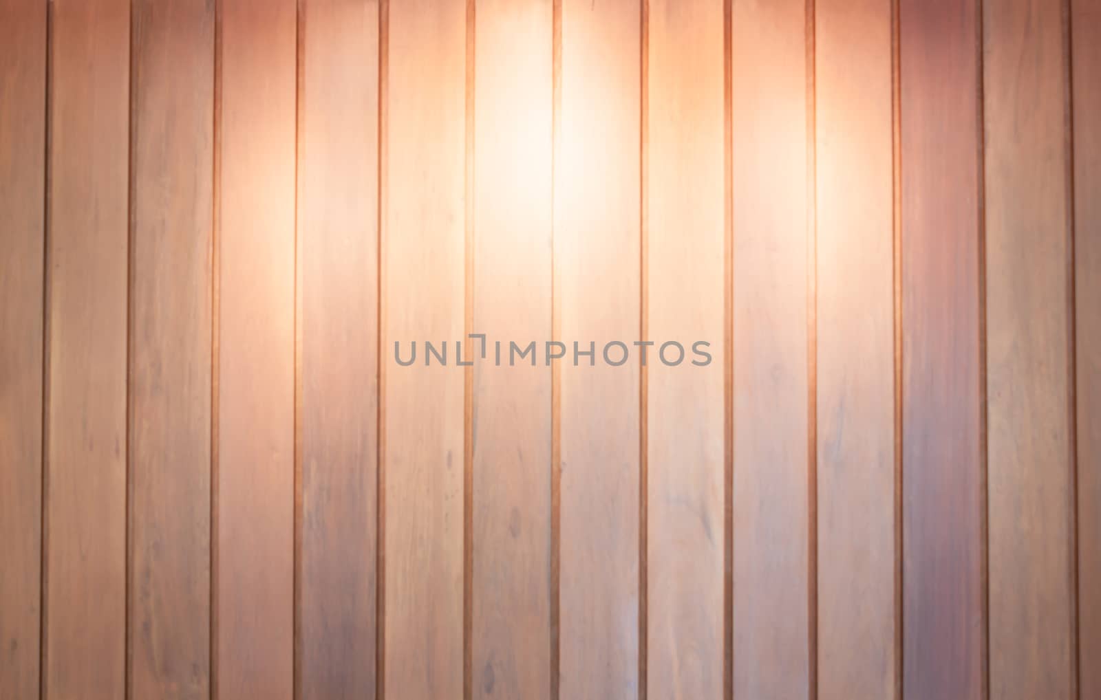 Spot light on wooden wall background, stock photo