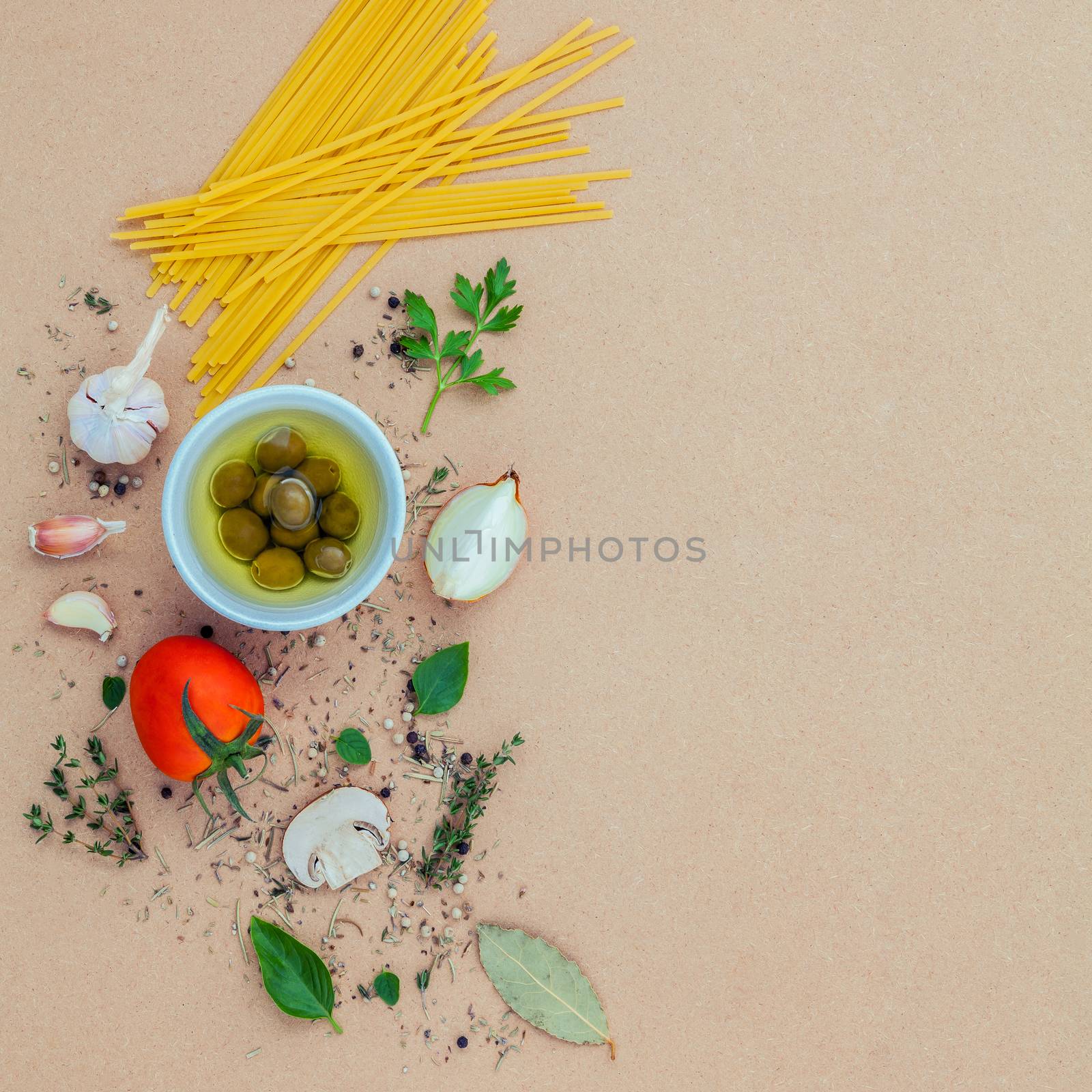 Italian food concept pasta with vegetables olive oil flavored with spices herb rosemary ,thyme,parsley and champignon mushroom set up with brown background.