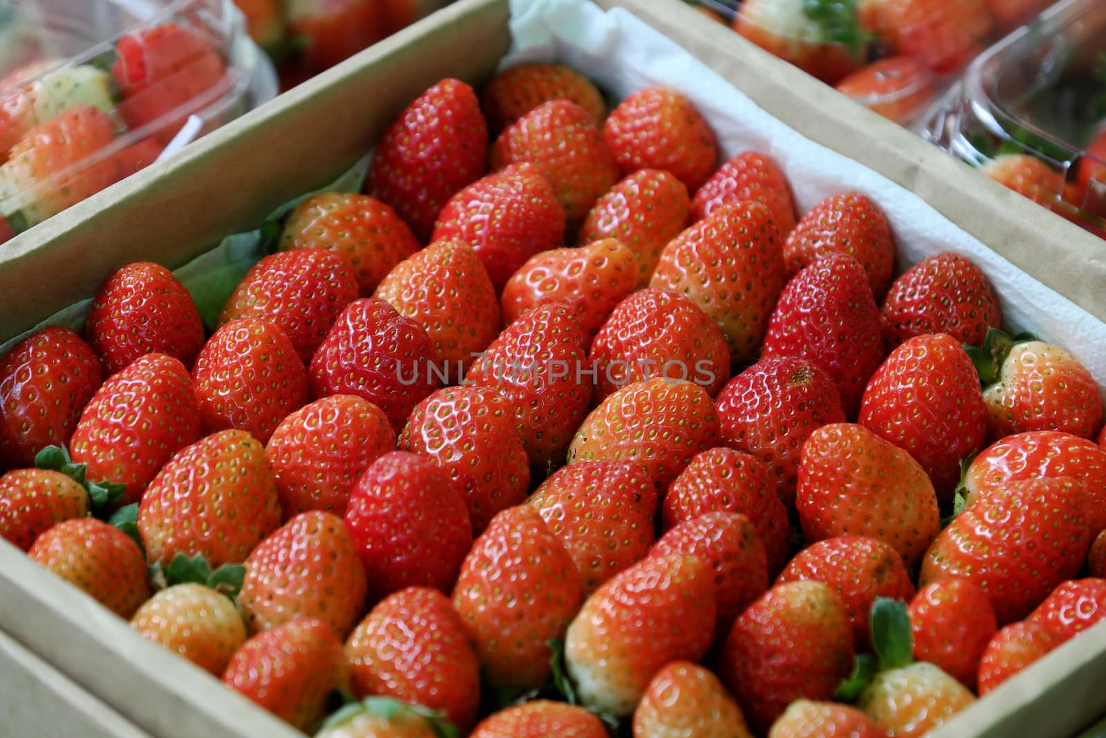 Basket of ripe red strawberry at Vietnam marketplace, fresh fruit, organic agriculture product, good for health, rich vitamin c