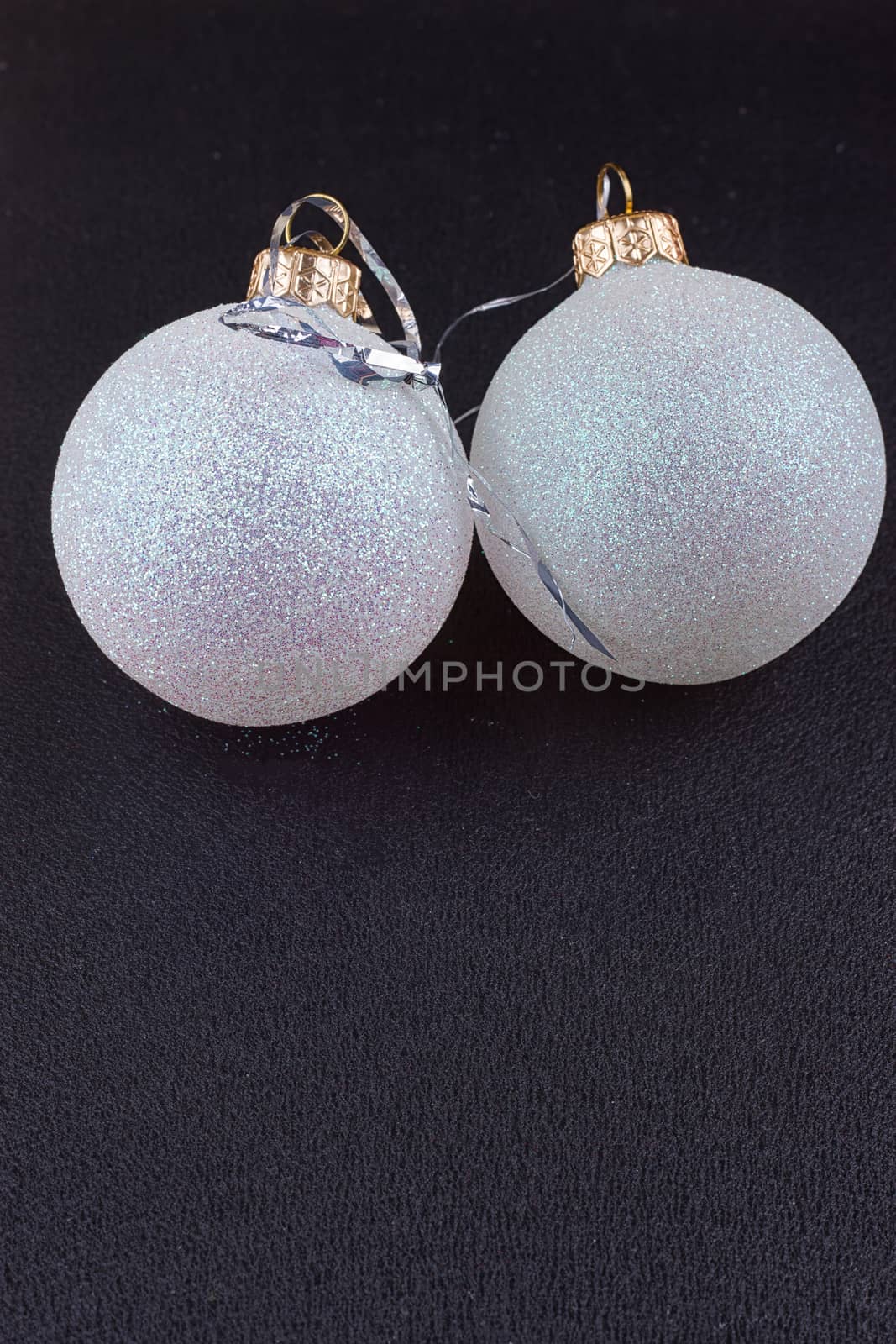 silver Christmas balls on the black background