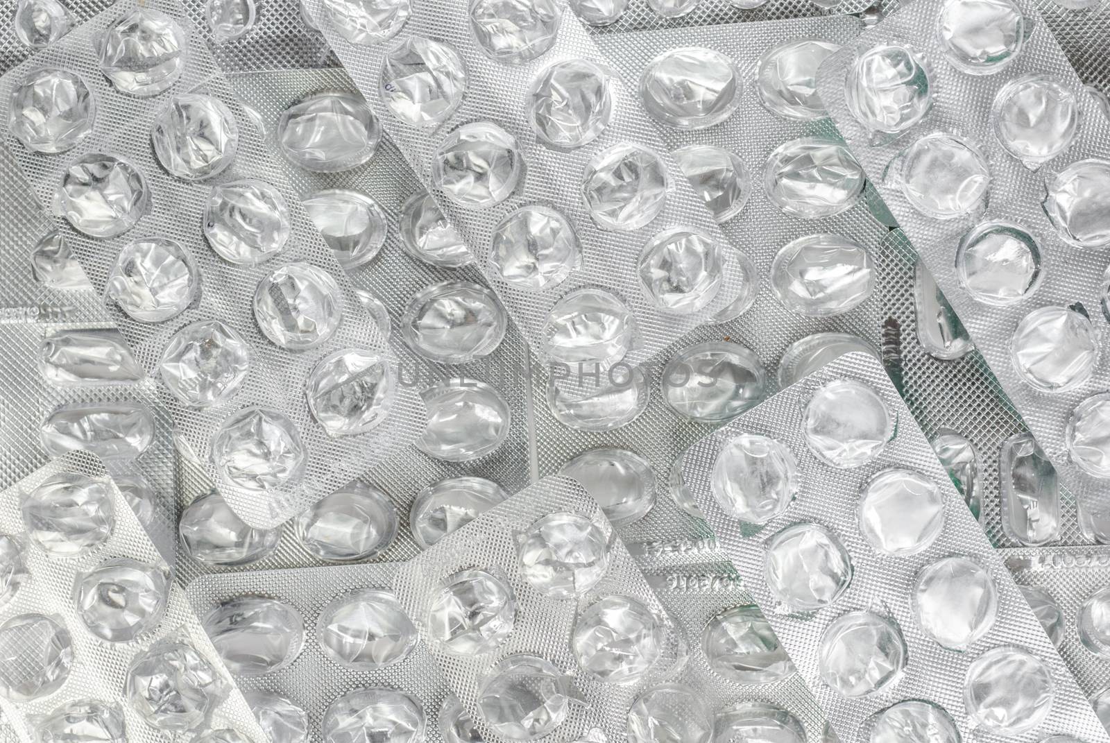 blank capsule of antibiotics in blister packaging close up on a light background by uvisni