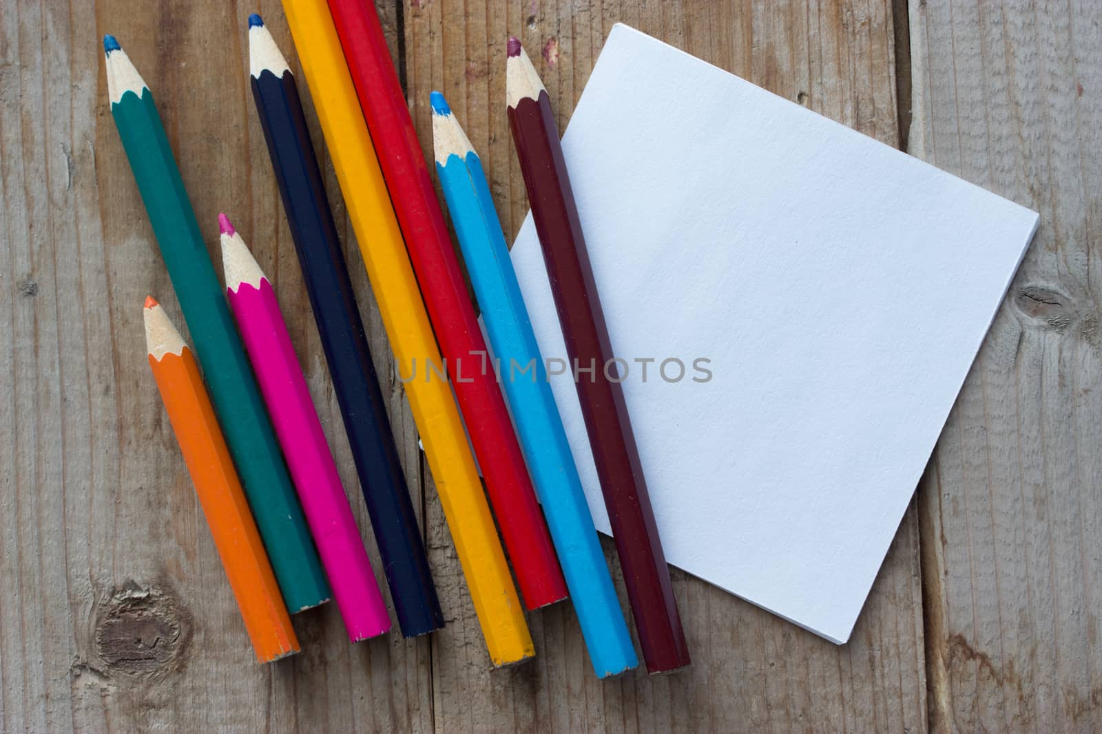colorful crayons and peace of paper, mock up