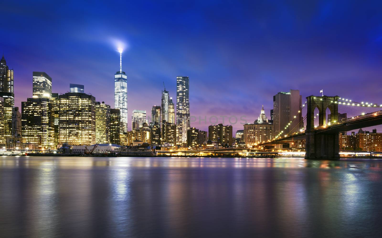 New York City - beautiful sunset over manhattan with manhattan and brooklyn bridge