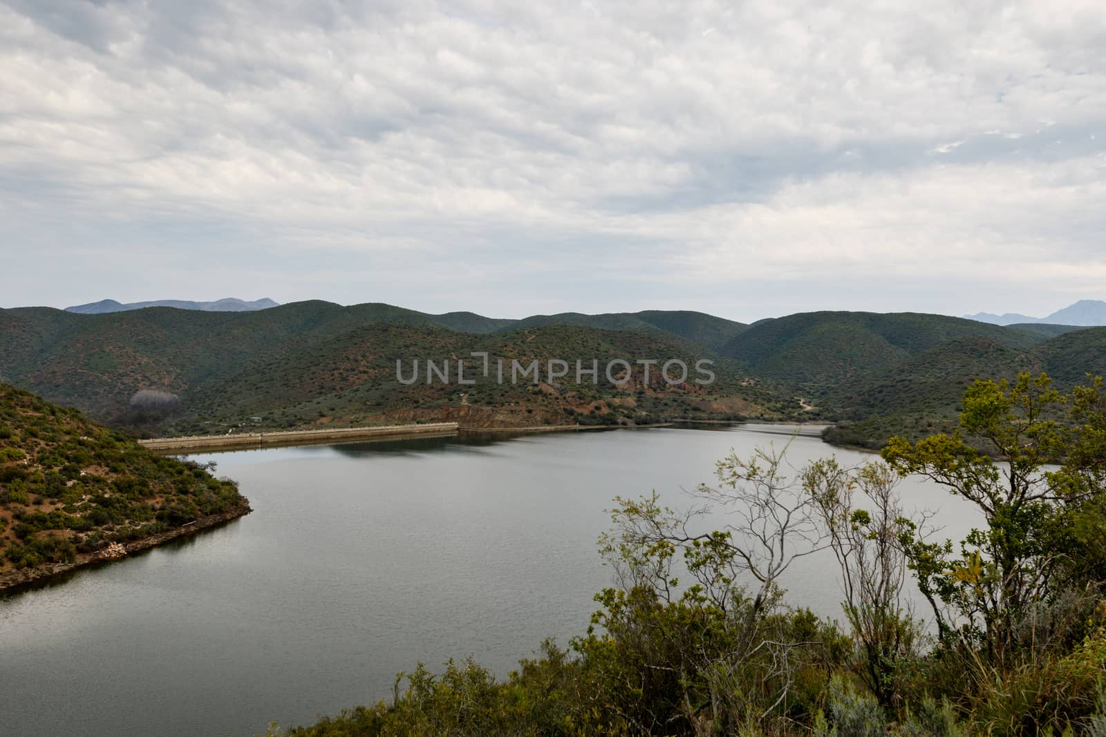 Cloudy and moody view from a bush of the dam at Calitzdorp.