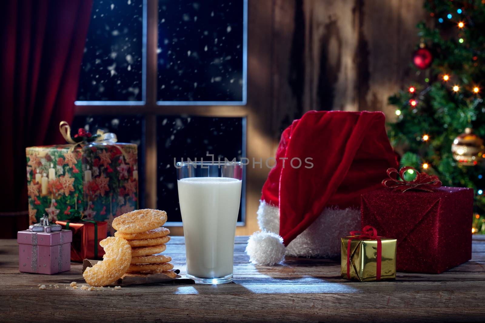 close up view of glass of milk with cookies on color back